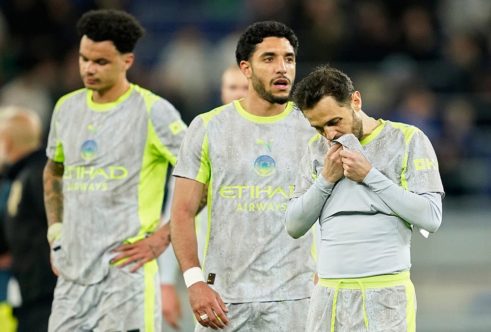 | Photo: AP/Dave Thompson : Manchester Citys Bernardo Silva, right, reacts after the Premier League soccer match between Manchester City and Everton in Liverpool, England.