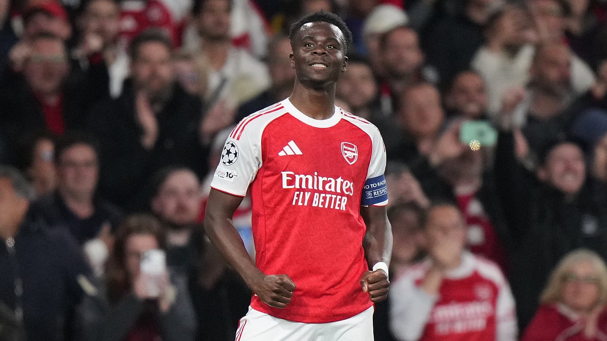 AP Photo : Arsenals Bukayo Saka celebrates after scoring the opening goal during a Champions League semifinal, second leg, soccer match between Arsenal FC and Atletico Madrid in London.