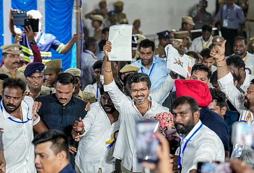 Source: PTI : Chennai: Tamilaga Vettri Kazhagam (TVK) chief and candidate from the Perambur constituency, Vijay, celebrates after winning in the Tamil Nadu Assembly elections results, in Chennai, Monday, May 4, 2026.