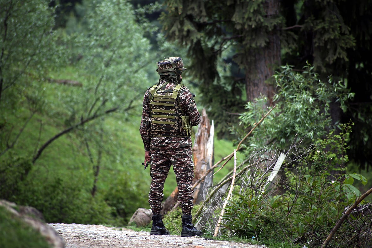 IMAGO : ​
CRPF troop member standing guard in Jammu and Kashmirs Shopian district