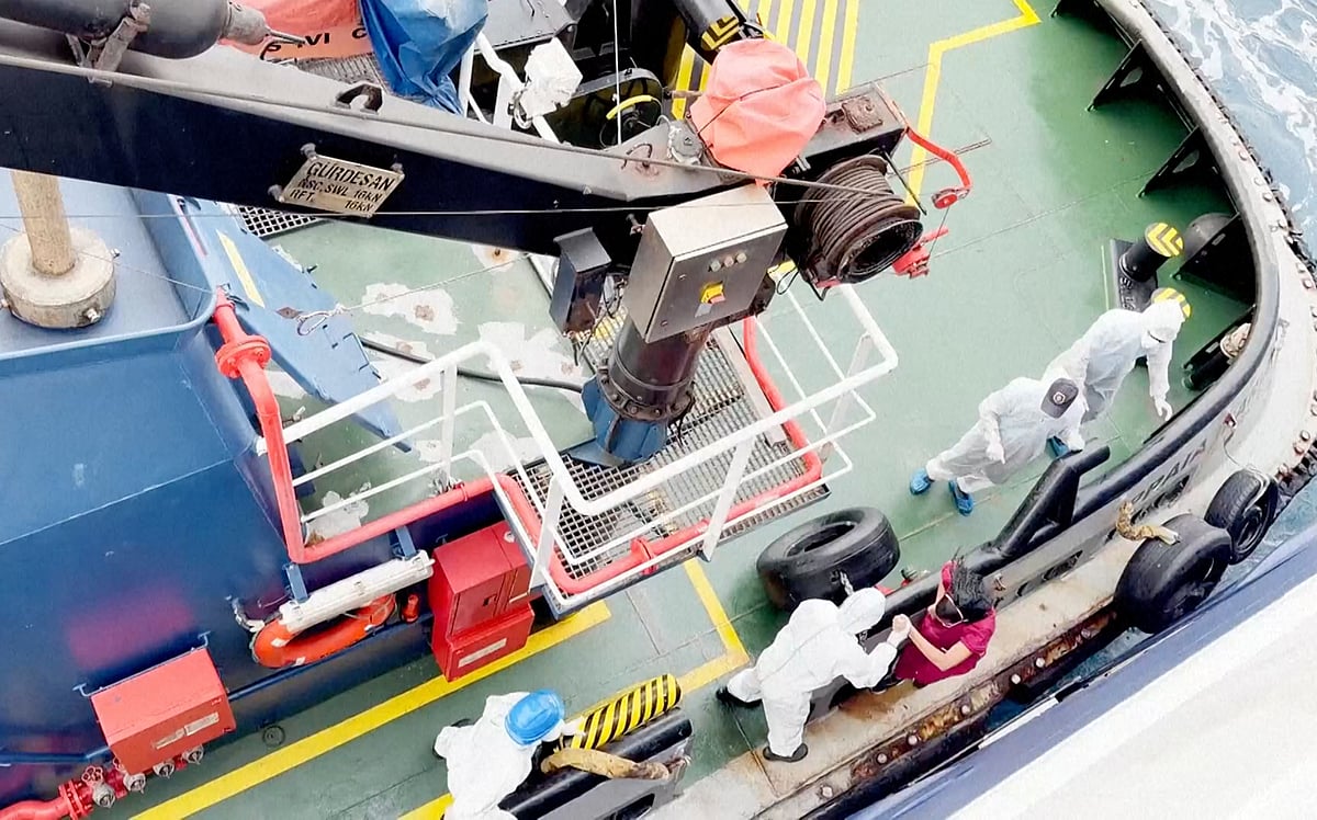 AP : Health workers get off the Dutch-flagged MV Hondius, a cruise ship carrying nearly 150 people, as it remains off Cape Verde on Monday, May 4, 2026, after three passengers died and several others fell seriously ill in a suspected hantavirus outbreak.  