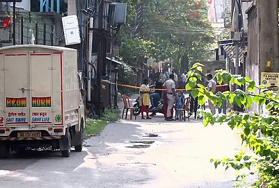 | Photo: PTI : Police personnel investigate after BJP leader Suvendu Adhikaris personal assistant Chandranath Rath was allegedly shot dead, in Madhyamgram, North 24 Parganas district.