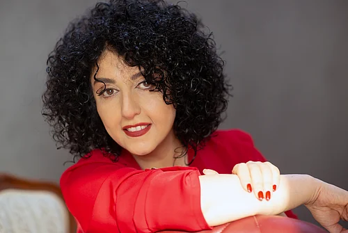 (Nooshin Jafari/Narges Mohammadi Foundation via AP) : This photo provided by the Narges Mohammadi Foundation shows Narges Mohammadi posing for a portrait in Tehran, Iran on Feb. 9, 2025.