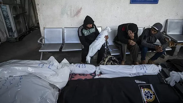 Palestinians mourn deaths of their relatives.